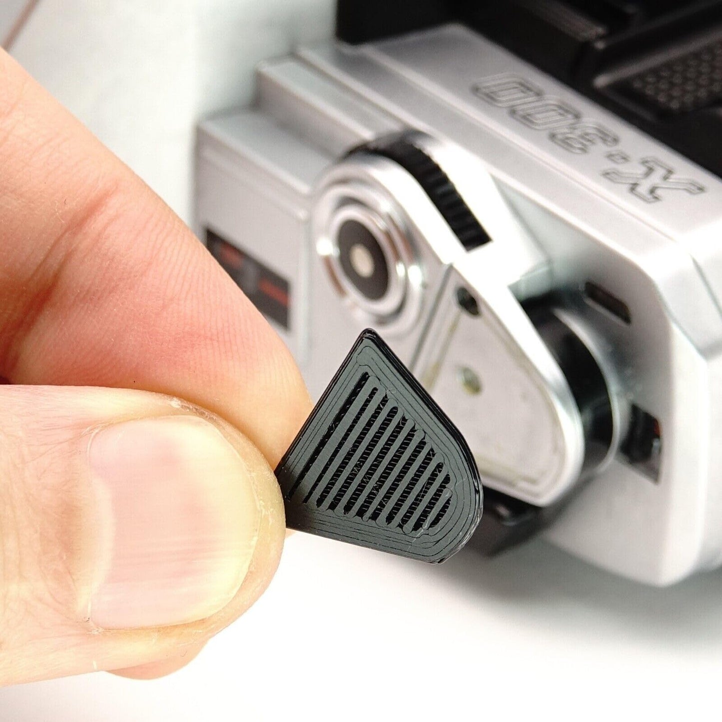 Reposadedos embellecedor para Minolta X-300 y X-370